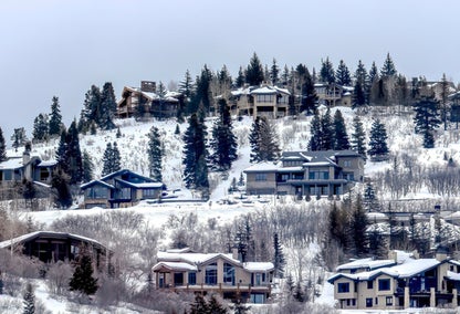 A few homes on a snowy hill in Park City, Utah.