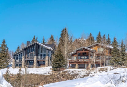 Beautiful, snowy homes on a hill outside of Kamas Valley, Utah.