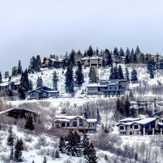 A few homes on a snowy hill in Park City, Utah.