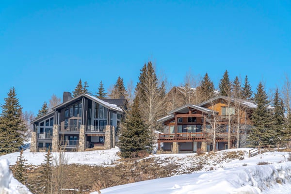 Beautiful, snowy homes on a hill outside of Kamas Valley, Utah.