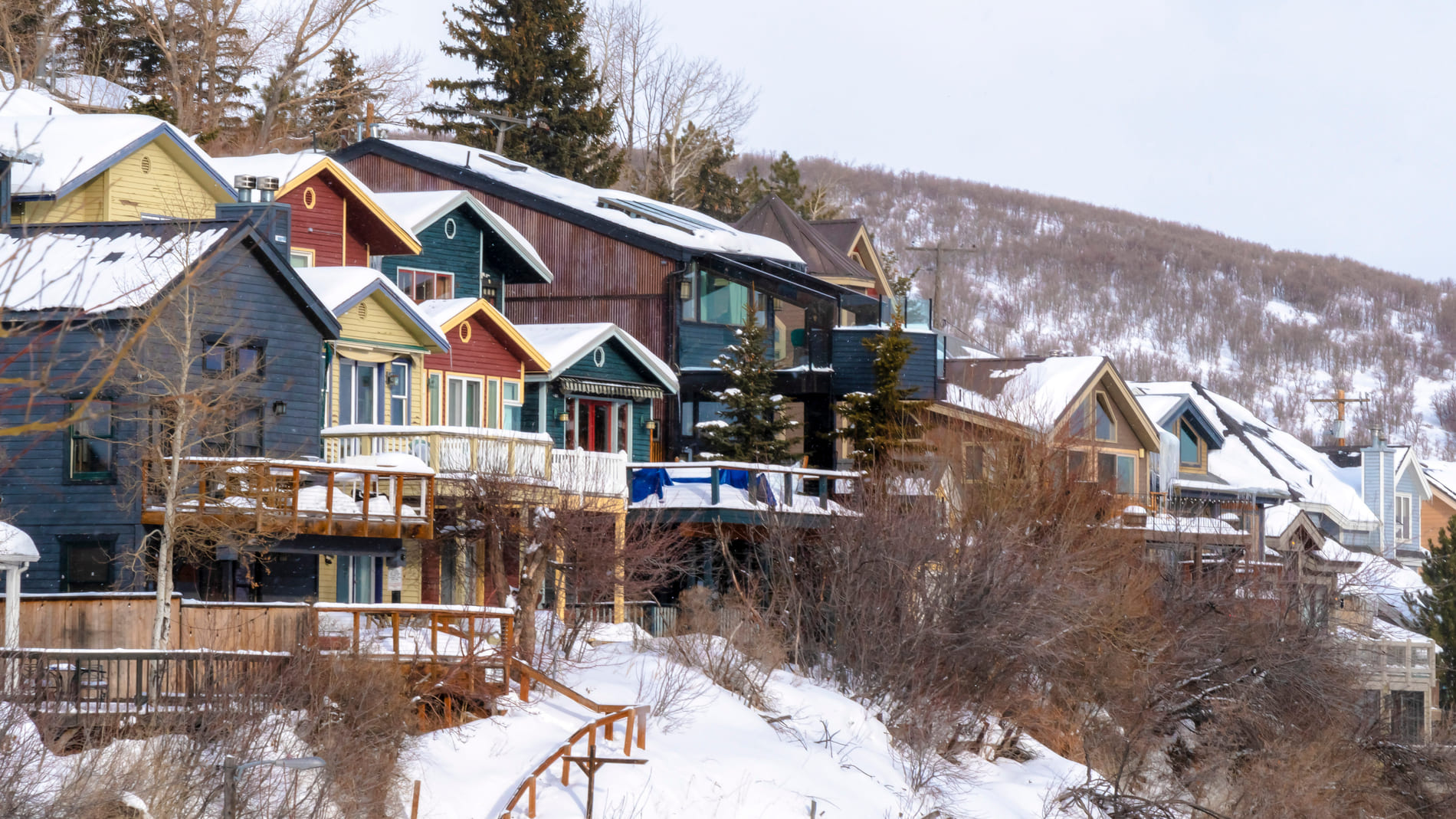 Homes sitting on a wintery hill in Park City, Utah.